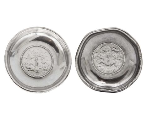 A pair of Chinese silver Yuan empire inset one dollar coin pin dishes. Diameter 8cm, weight 94.9g.