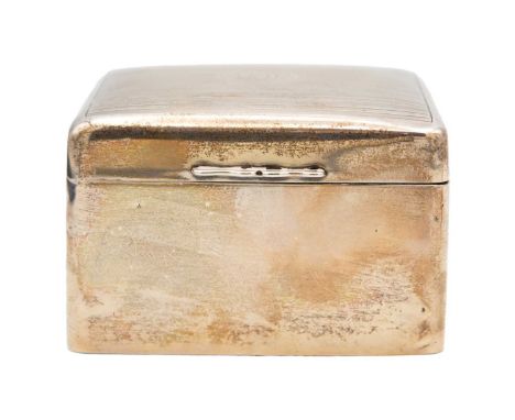 A silver cigarette box by A & J Zimmerman Ltd. The square section box with engine-turned decoration on the hinged lid, wooden