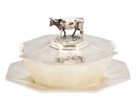 A Victorian silver and porcelain butter dish with cow finial by Edward and John Barnard. Of octagonal form, with scroll engra