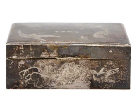 A Chinese silver hinge lidded cigarette box. Engraved with foliage and birds, the lid with engraved dedication, signed to the