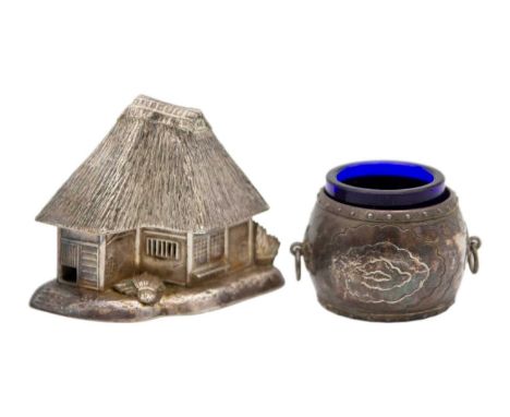A Chinese silver novelty two section cruet in the form of a thatched cottage. The roof formed as the pepperette, the base wit
