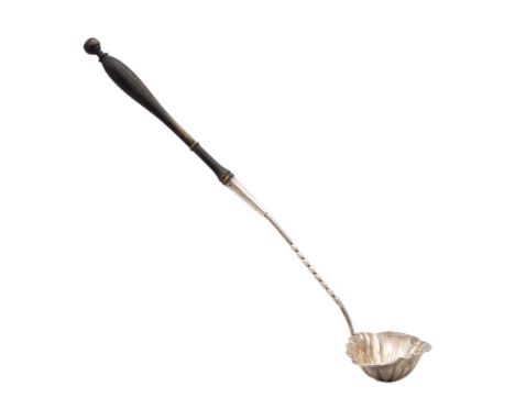 A Georgian silver ladle with fluted bowl and turned wood handle. Indistinct makers mark, length 31.5cm, gross weight 35.2g.