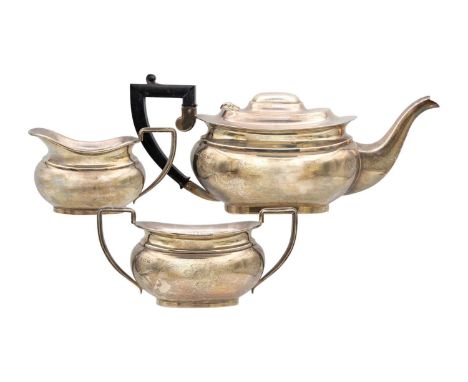 A three piece silver tea set by William Adams Ltd, Birmingham 1939. Teapot length 31cm, total weight 40.85 oz.