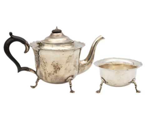 An Edwardian silver two piece tea set by Robert Pringle & Sons. London 1910, the teapot with ebonised handle and finial, rais