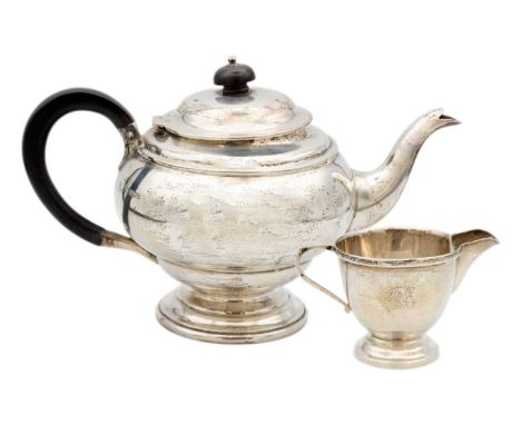 A George V silver ovoid pedestal teapot by James Deakin & Sons. Sheffield 1929, height 15cm, 15.38 oz; together with a simila