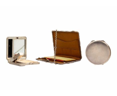 A Victorian silver aide memoir, and two silver engine-turned compacts. The aide memoir with foliate engraved decoration, leat