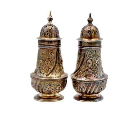 A pair of Victorian silver foliate embossed pepper casters by Josiah Williams & Co. London 1890, height 12.5cm, 5.75 oz.