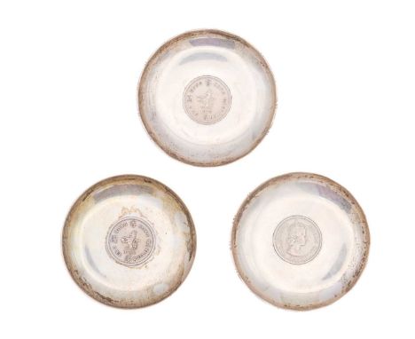 Three modern Chinese sterling silver pin dishes. Each inset with an Elizabeth II nickel coin, stamped STERLING MADE IN HONGKO