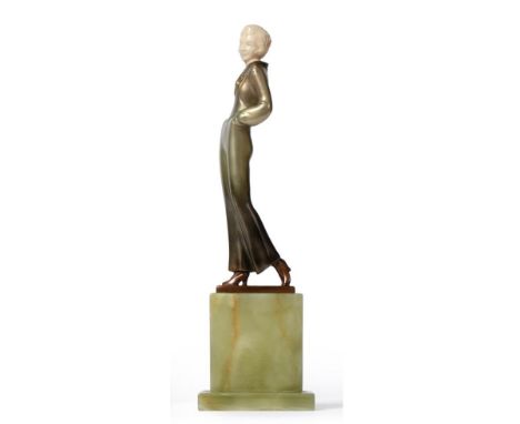 Josef Lorenzl (Austrian, 1892-1950): An Ivory and Cold-Painted Bronze Figure, circa 1925, modelled as a young woman wearing w