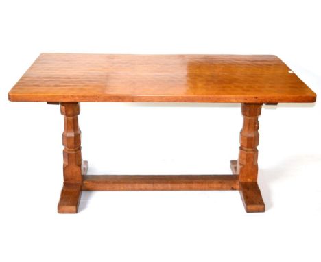 A Robert ''Mouseman'' Thompson Oak 5ft Refectory Table, on two octagonal legs, joined by a floor stretcher, with carved mouse