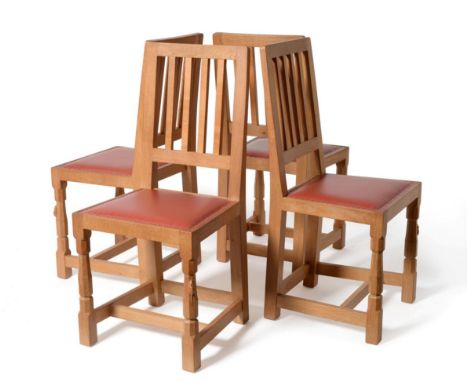 A Set of Four Robert ''Mouseman'' Thompson Millennium Range Oak Dining Chairs, with curved back above four vertical spindles,