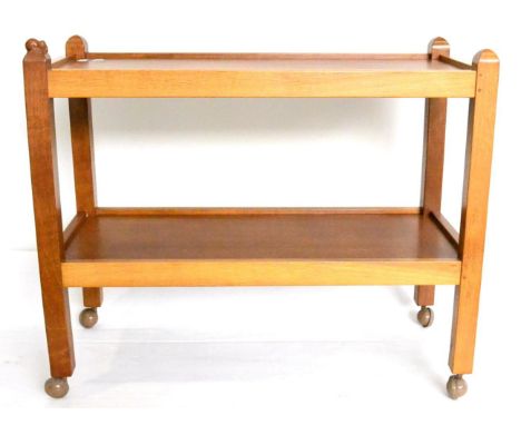 A Robert ''Mouseman'' Thompson Oak Tea Trolley, with two tiers both with raised sides joined by four square section legs, on 