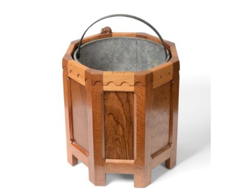 A Robert ''Mouseman'' Thompson Panelled Oak Octagonal Planter, dated 1997, contrasting fumed oak panels, with a cylindrical r