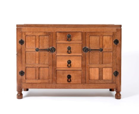 A Robert ''Mouseman'' Thompson Panelled Oak 4ft Sideboard, with raised upstand above four central graduated drawers enclosed 