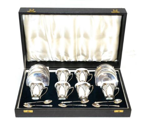 An Art Nouveau Royal Doulton and Silver Coffee Set, by Roberts & Belk, with six white glazed cans mounted with silver holders