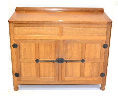 A Robert ''Mouseman'' Thompson Entertainment Cupboard, the rectangular top over double panelled doors, enclosing a shelf, wit