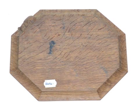 A Robert ''Mouseman'' Thompson Oak Bread Board, with carved mouse signature, 31cm