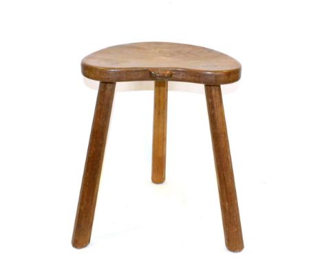 A Robert ''Mouseman'' Thompson Oak Cow Stool, on three legs, with carved mouse signature on seat, 45cm