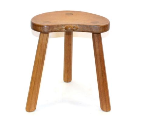 A Robert ''Mouseman'' Thompson Oak Calf Stool, on three octagonal legs, with carved mouse signature on seat, 35.5cm