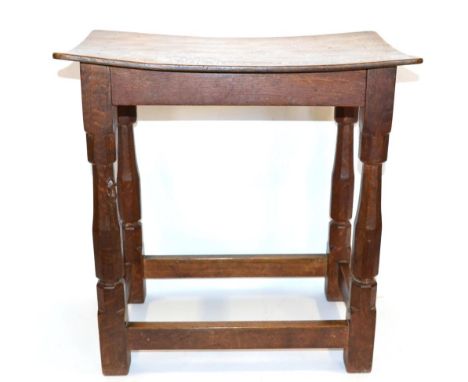 A Robert ''Mouseman'' Thompson Oak Dish Top Stool, on four octagonal legs joined by stretchers, with carved mouse signature, 