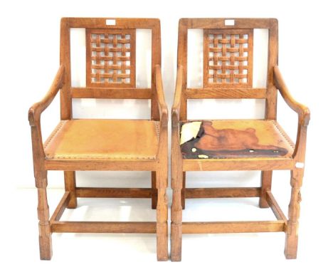 Two Robert ''Mouseman'' Thompson Oak Lattice Back Armchairs, on two octagonal front legs, each with carved mouse signature, 9