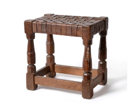 A Robert ''Mouseman'' Thompson Oak Stool, with lattice leather top, on four octagonal legs joined by stretchers, pop marks, w