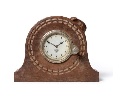 A Robert ''Mouseman'' Thompson Oak Mantel Clock, the circular case with chip carving, set with a Smith's clock from a 1930's 