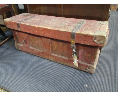 A 19th century red canvas and leather bound trunk, with Royal coat of arms and standing lions to top and front, the interior 