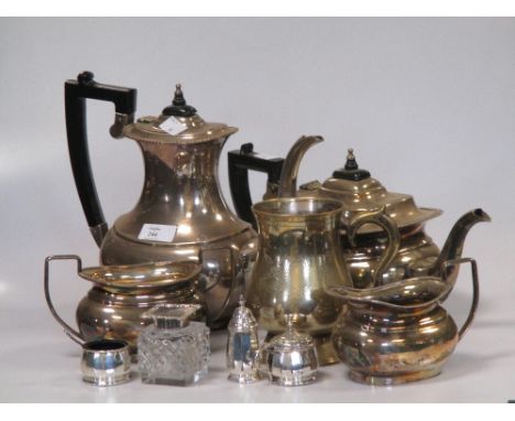 A silver topped glass inkwell circa 1900, a small three piece silver cruet and a plated tea and coffee set marked Garrard and