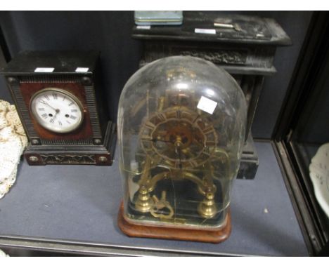 A late Victorian brass skeleton clock under a glass dome (cracked) together with a slate mantle clock and a continental mantl