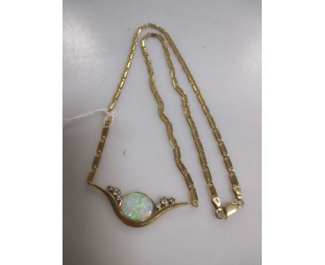 An 18ct gold opal and diamond set pendant by Christopher Wharton (opal damaged) with an aftermarket chain marked '585', gross