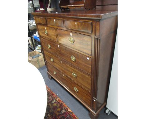 A late Regency North country mahogany chest of three small frieze drawers over four long graduated drawers on bracket feet, 1