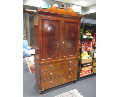 A Regency mahogany linen press with fret carved scroll pediment, converted for hanging, on bracket feet, 224 x 121 x 54cm  