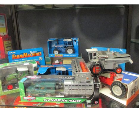 A Teamsterz 4x4 and livestock trailer, boxed, An ERTL Ford 8630 Tractor, boxed, and another, A die-cast model of a Fendt Trac