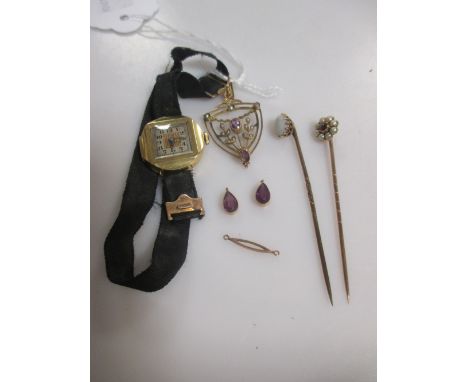An 18ct gold watch on a ribbon strap, together with two stick pins and an Edwardian pendant stamped '9ct' (4)  