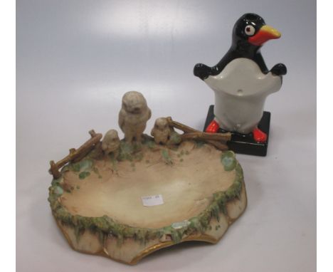 A Carlton Ware penguin lamp base, probably for Guinness &amp; a Royal Dux dish mounted with an owl  