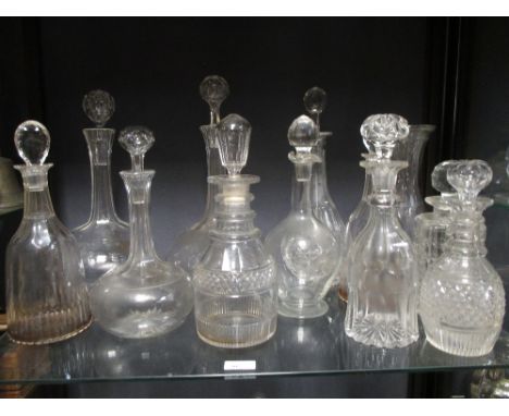 A collection of 19th century and later glass decanters and stoppers to include a pair of triple ring necked decanters and sto