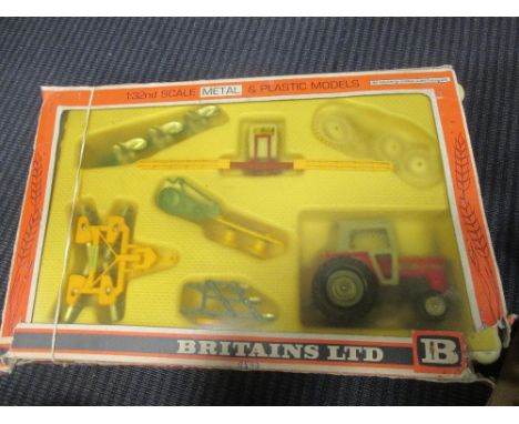 Britains; A 9592 Farm Tractor and implement set, four 4703 pig sty sets, 9629 rear dump, 4381 zoo models rock pit, 4382 Tropi