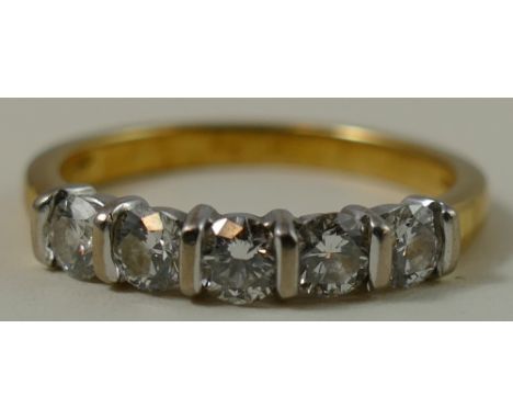 An 18ct gold five stone diamond ring, claw set with brilliant cut stones, total weight approximately 0.75cts, colour estimate