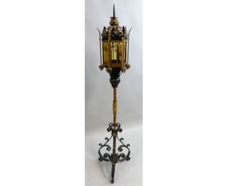 A late 19th century French Arts and Crafts Gothic style wrought iron lamp standard, the hexagonal lantern top with gilded str