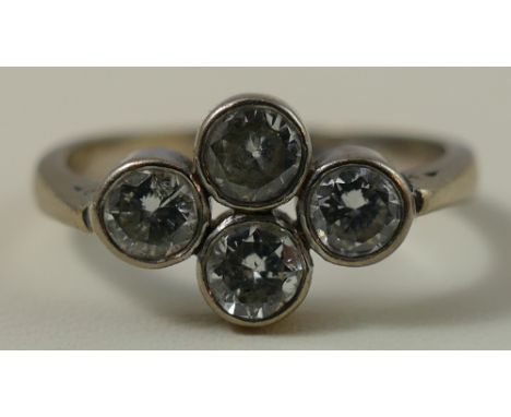 A four stone diamond ring, collet set with old cut brilliant stones, total weight approximately 0.80cts, size M 1/2.