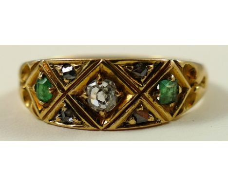 An 18ct gold emerald and diamond panel ring, diamond points between, size O 1/2.