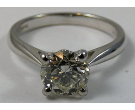 A platinum and diamond single stone ring, claw set with a brilliant cut stone, estimated to weigh 1.40cts, estimated colour L