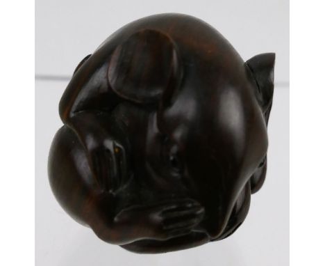 A Japanese carved hardwood netsuke, as a coiled mouse with inset glass eyes, inlaid mother-of-pearl two character seal mark, 