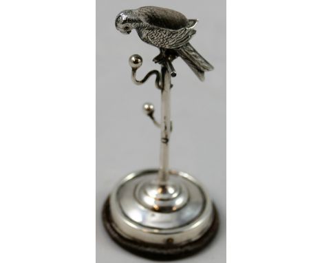 An Edwardian silver novelty pin cushion/ring tree, Birmingham 1906, in the form of a parrot on his perch, height 7.5 cm, load