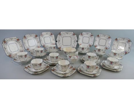 A Shelley Queen Anne shape tea set, in the Peaches and Grapes pattern No. 11498, comprising twelve of each cups, saucers and 