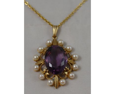 A 9ct gold amethyst and pearl oval cluster pendant, claw set with a mixed cut stone bordered by cultured pearls, chain, 10 gm