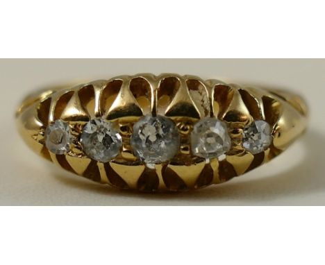 An Edwardian 18ct gold five stone diamond ring, Birmingham 1904, claw set with graduated old cut stones, size