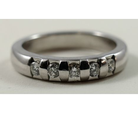 A 9ct white gold five stone diamond ring, Millennium hallmark, claw set with brilliants, weight 6 gms, size P.