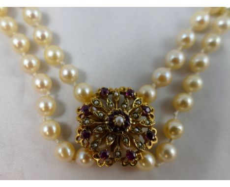 A Opera length single row uniform cultured pearl necklace, diameter 6 mm, length 100 cm, together with a 9ct gold ruby and pe